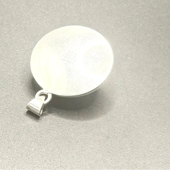 A Sterling Silver Round Pendent with a Lg Amber stone